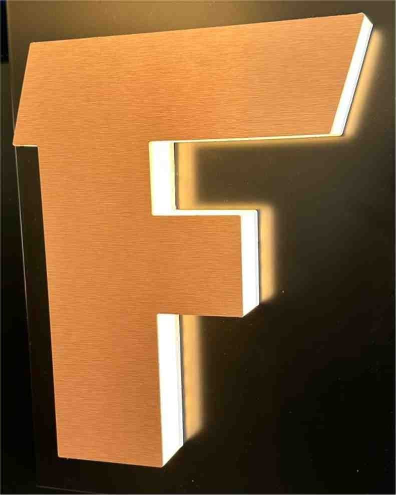 A letter F with light glowing evenly through its translucent returns